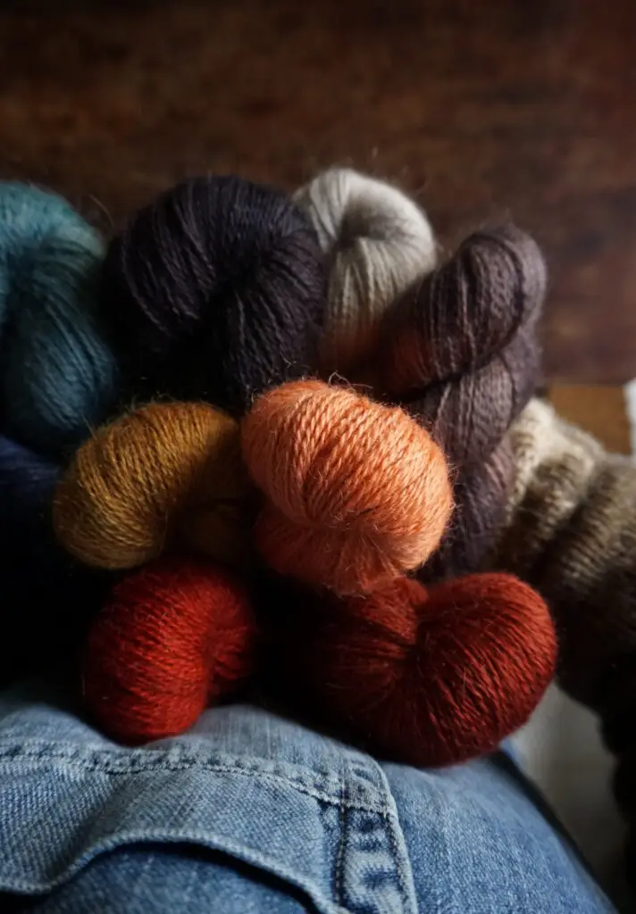 Saskia with an arm full of yarn, taken from her view.